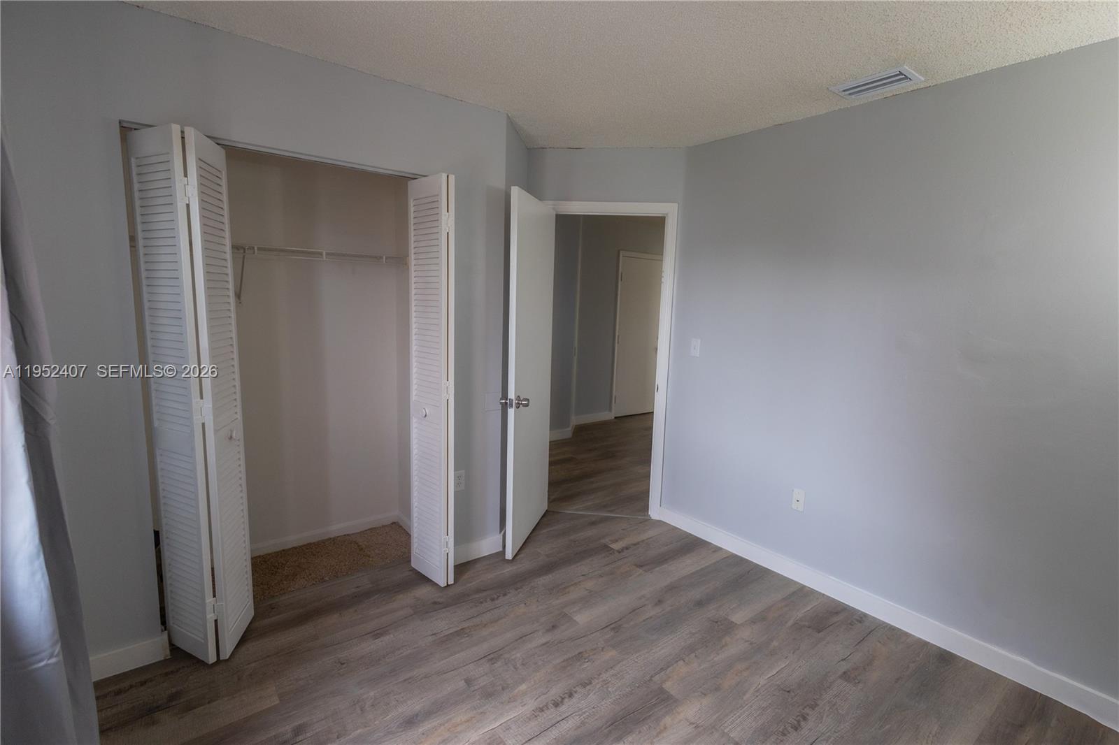 16831 Southwest 139th Place Miami, FL 33177 - Photo 23 of 39 a view of a hallway with wooden floor