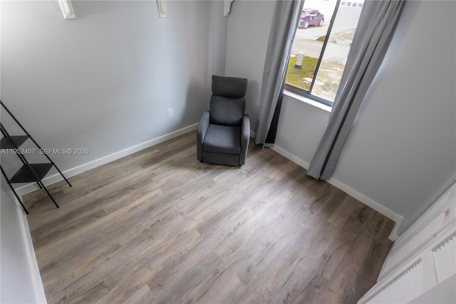 16831 Southwest 139th Place Miami, FL 33177 - Photo 24 of 39 a room with window and stairs