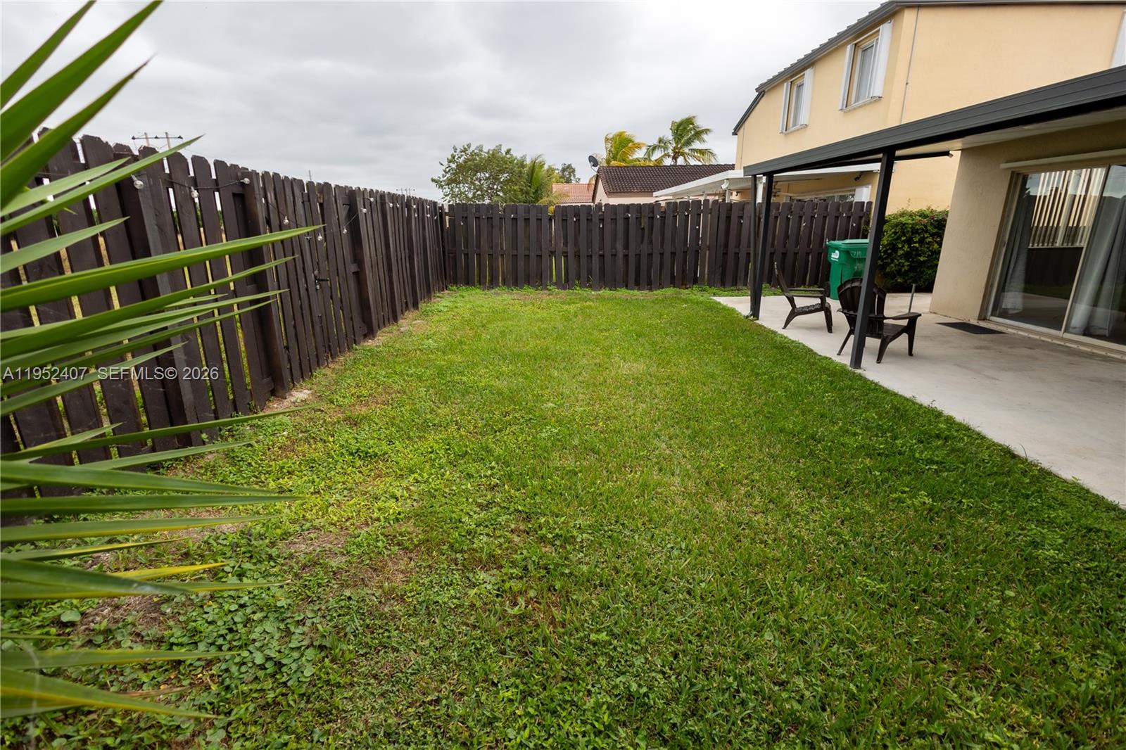16831 Southwest 139th Place Miami, FL 33177 - Photo 34 of 39 a view of a backyard with sitting area