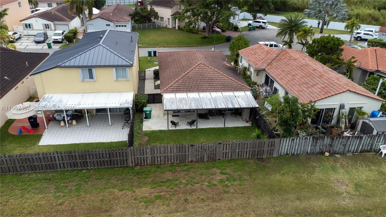 16831 Southwest 139th Place Miami, FL 33177 - Photo 38 of 39 an aerial view of a house with swimming pool patio and backyard