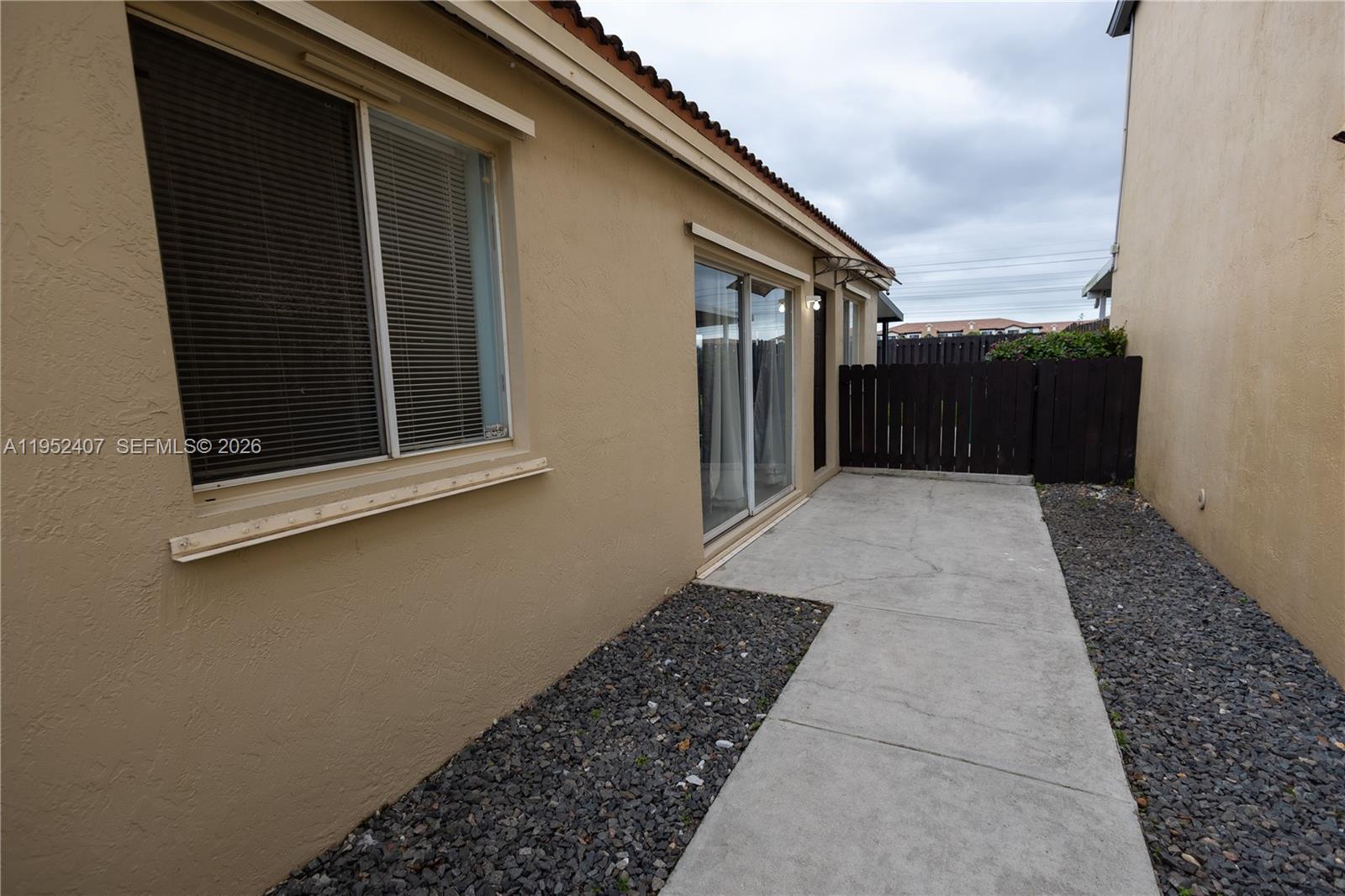 16831 Southwest 139th Place Miami, FL 33177 - Photo 5 of 39 a view of a house with a backyard