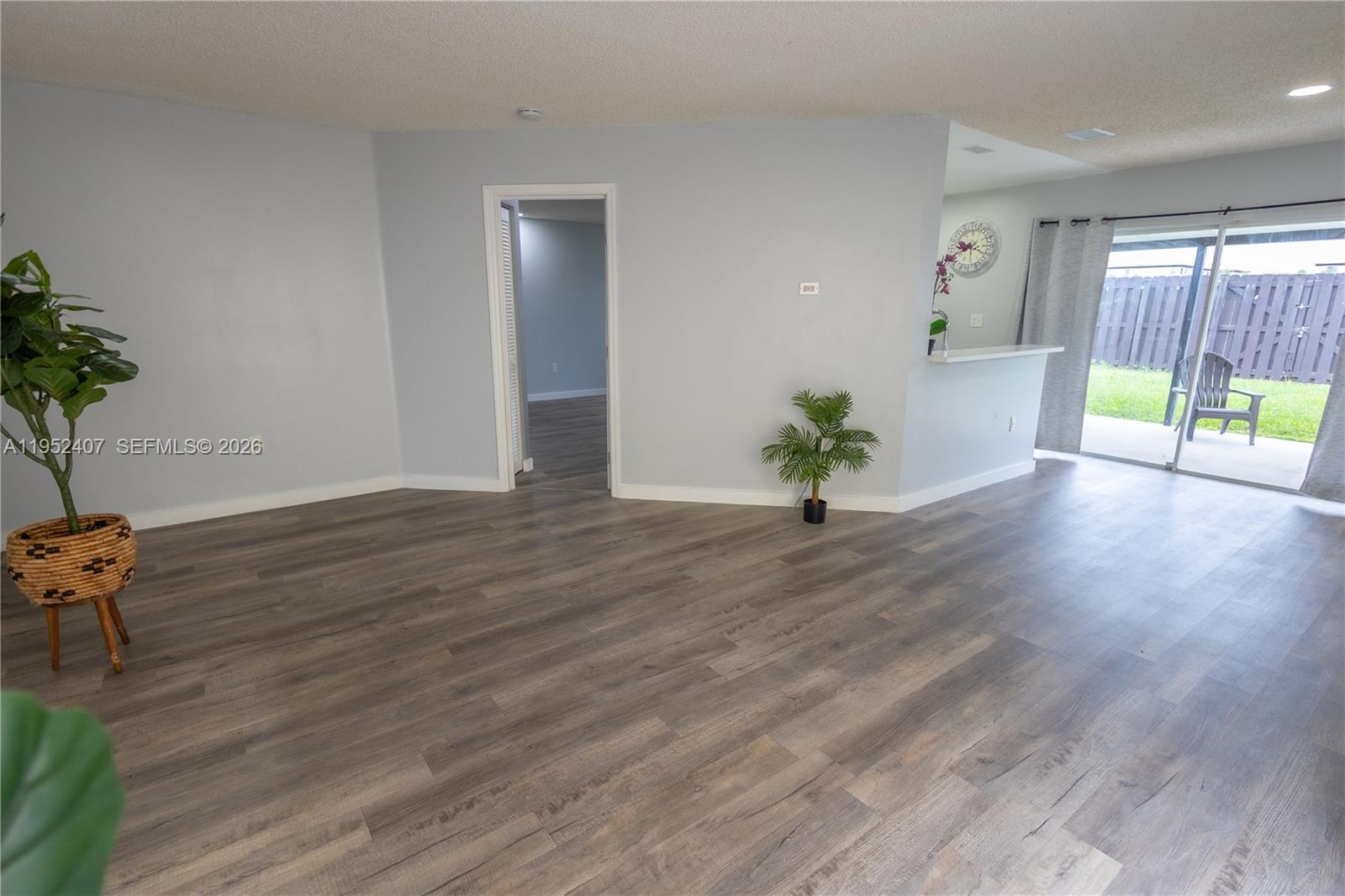 16831 Southwest 139th Place Miami, FL 33177 - Photo 9 of 39 a living room with wooden floor