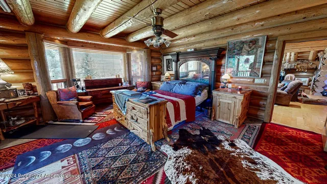 a bed room with a bed and a window