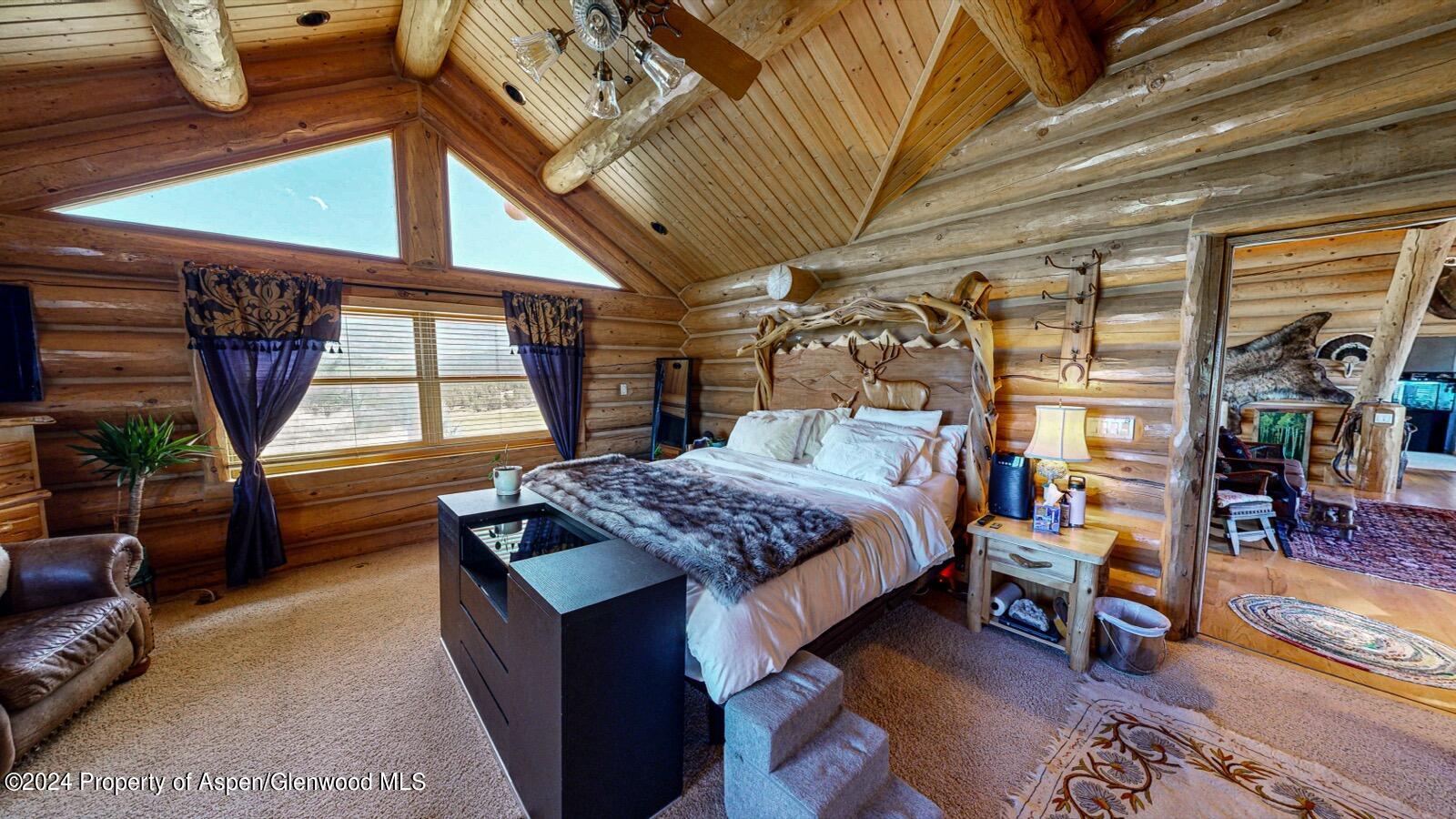 56106 Me Road Collbran, CO 81624 - Photo 19 of 34 a bedroom with bed and a window