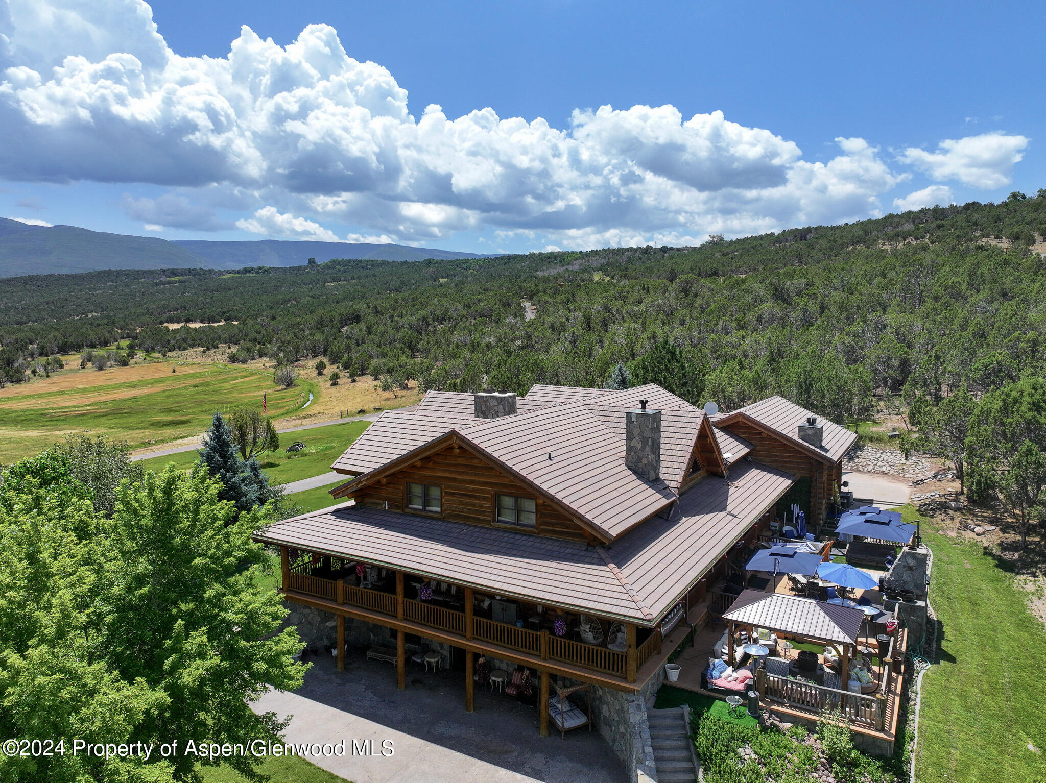 56106 Me Road Collbran, CO 81624 - Photo 2 of 34 an aerial view of a house with big yard