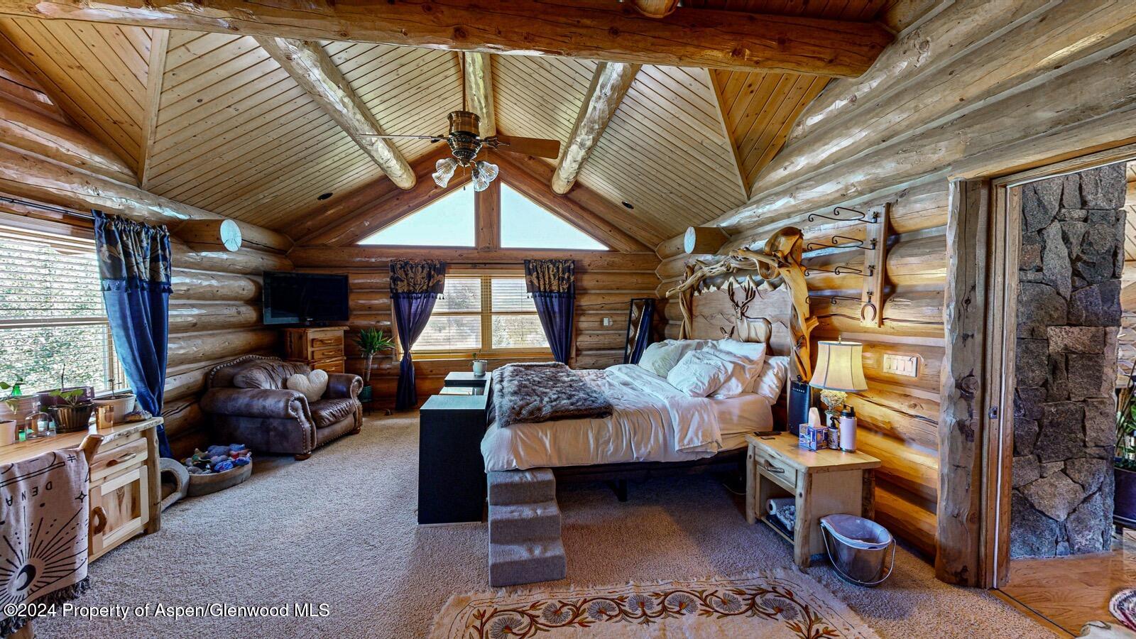 56106 Me Road Collbran, CO 81624 - Photo 21 of 34 a bedroom with furniture and a window