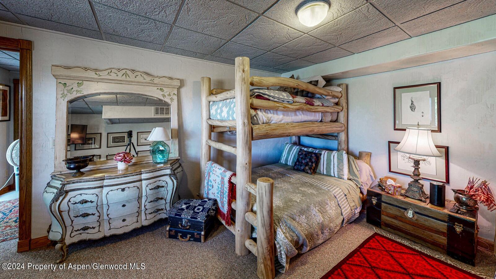 56106 Me Road Collbran, CO 81624 - Photo 23 of 34 a bedroom with a bed and a tv