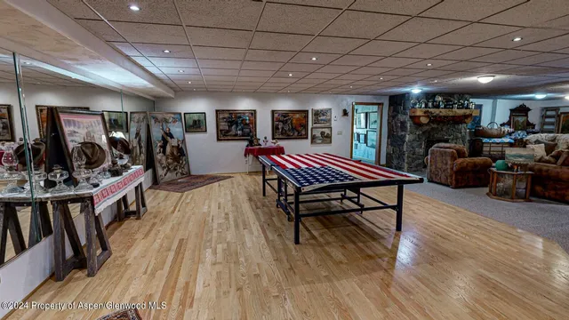 a bedroom with a bed couch and window