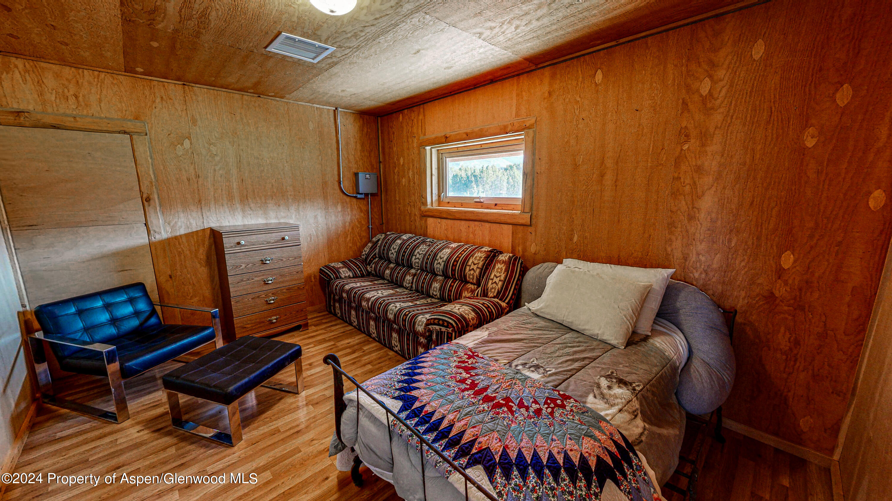 56106 Me Road Collbran, CO 81624 - Photo 30 of 34 a living room with furniture a rug and a window