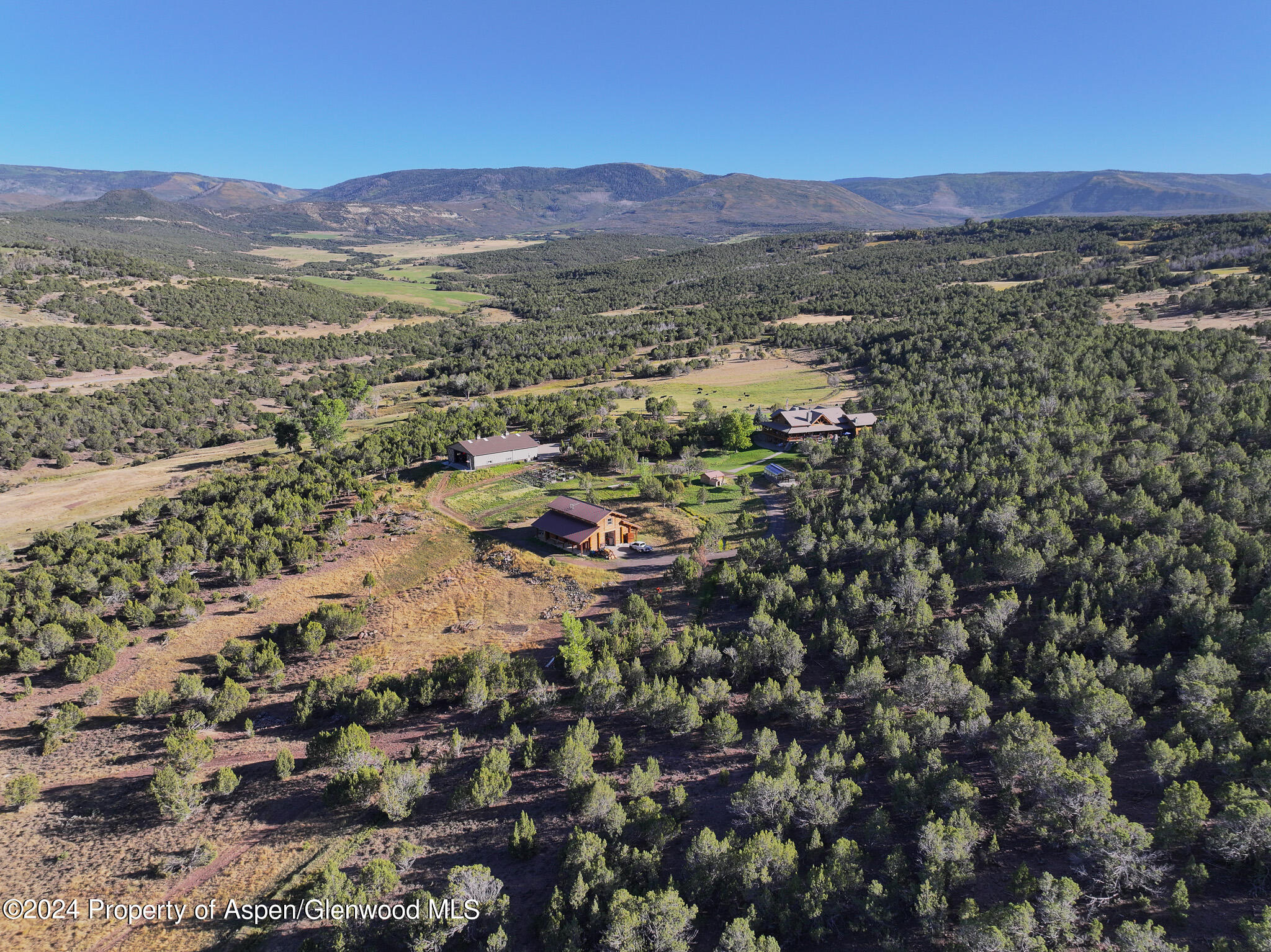 56106 Me Road Collbran, CO 81624 - Photo 3 of 34 an aerial view of residential house and green space