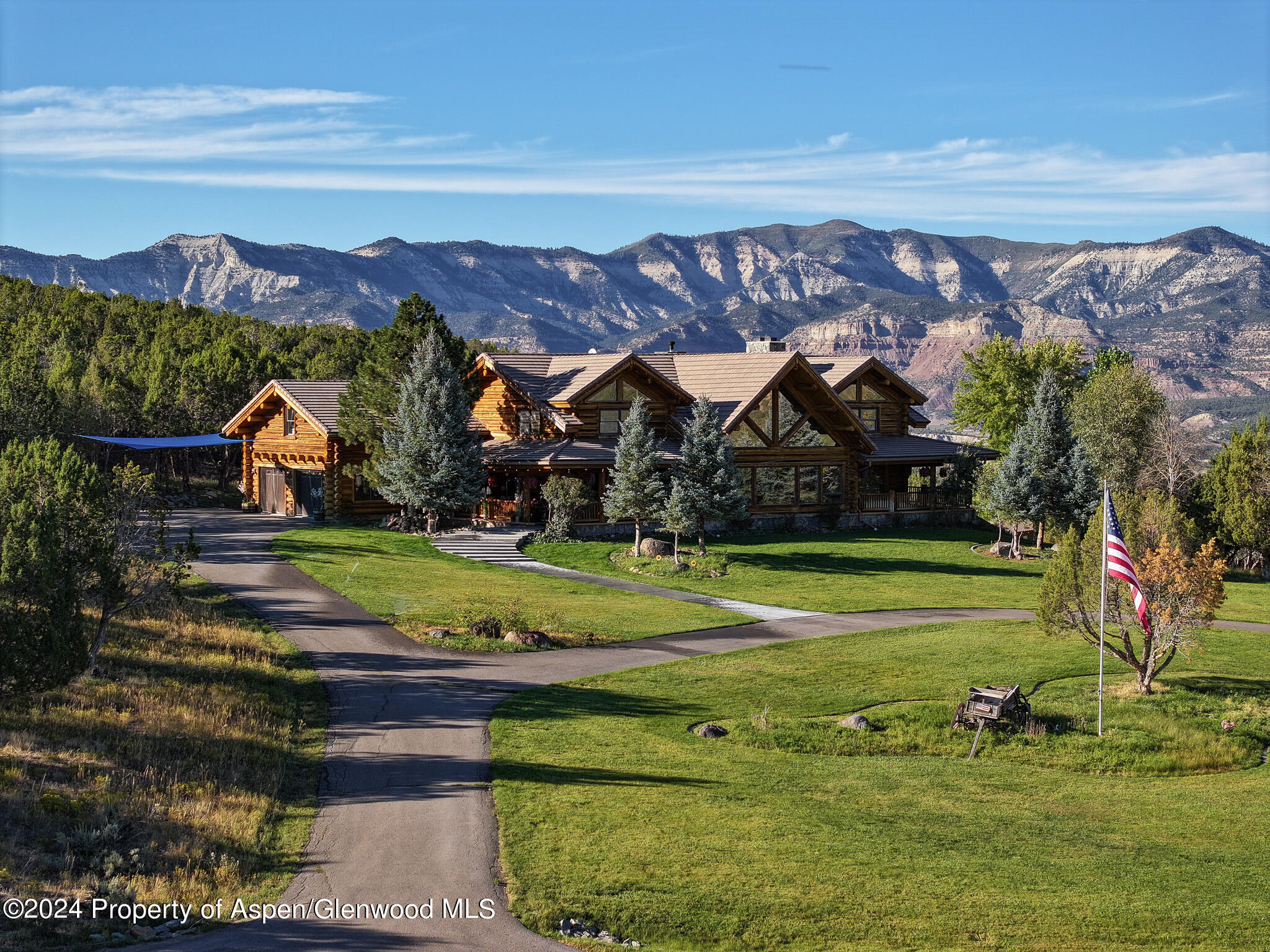 56106 Me Road Collbran, CO 81624 - Photo 8 of 34 a view of a house with a yard