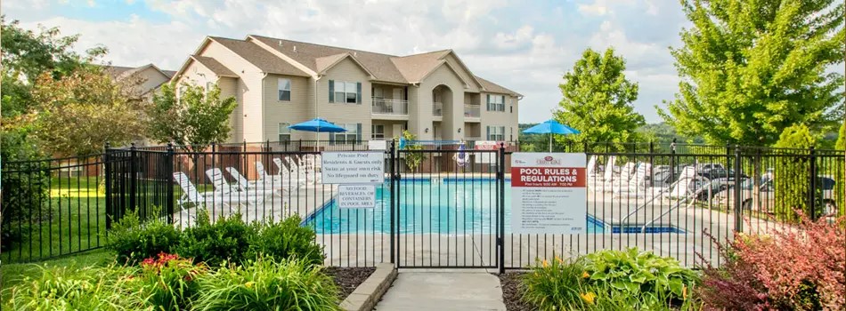 a view of a house with a small yard and plants