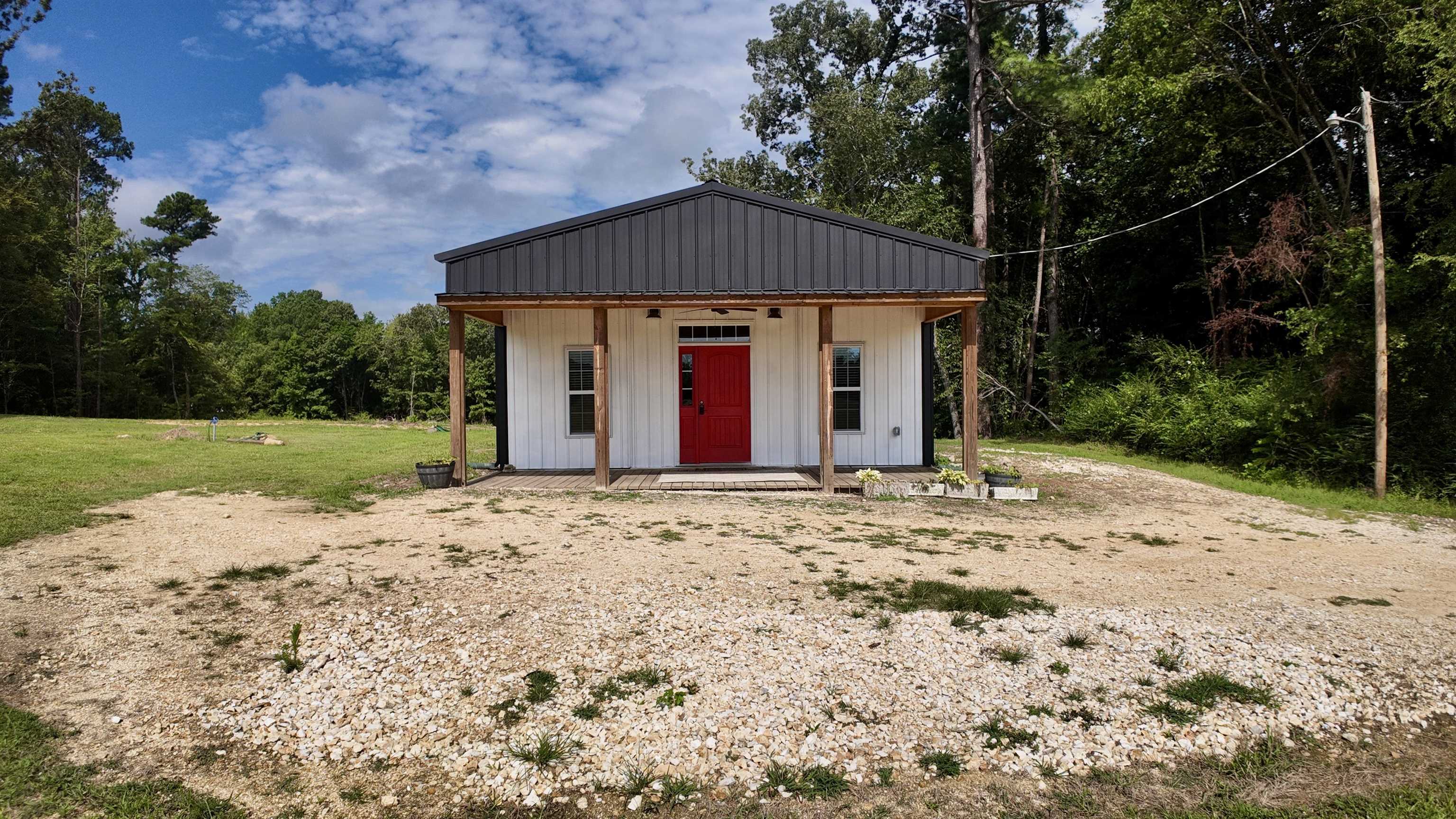 915 Pleasant Grove Road Springville, TN 38256 - Photo 1 of 18 a view of a house with a yard