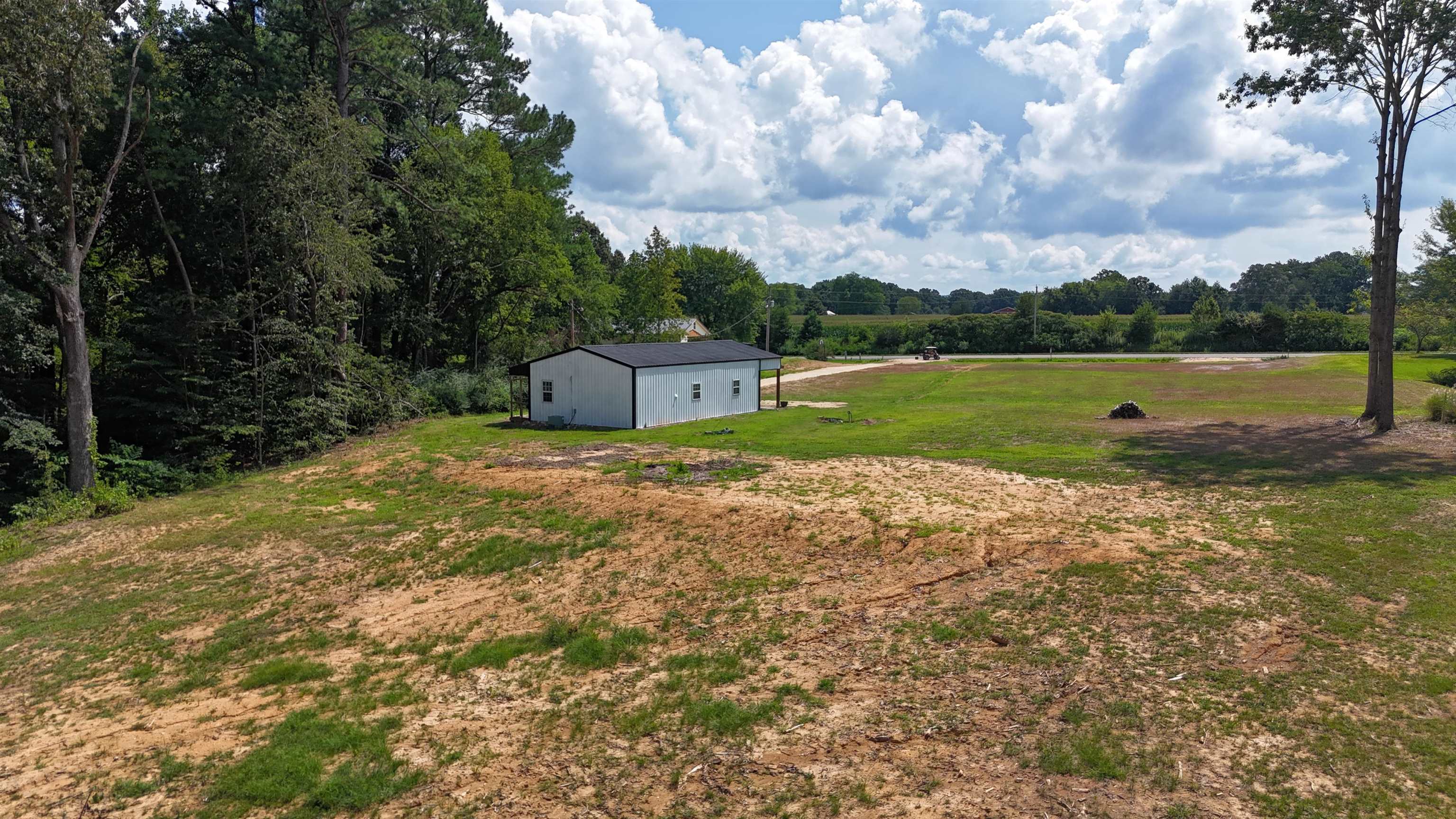 915 Pleasant Grove Road Springville, TN 38256 - Photo 16 of 18 a view of a lake with a big yard