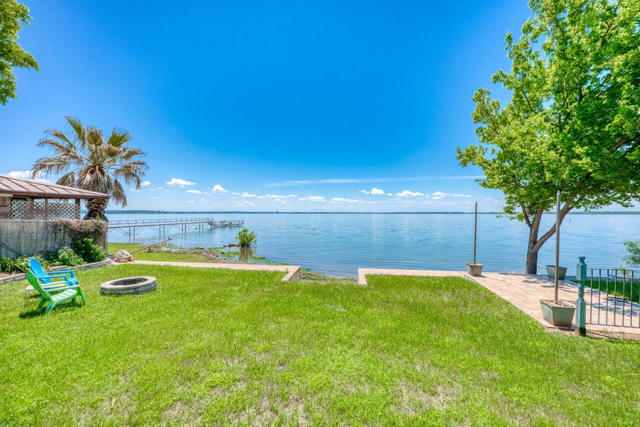 809 Lakeshore Loop Tow, TX 78672 - Photo 22 of 33 a swimming pool with wooden fence