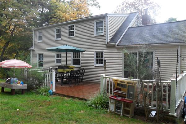 30 Adams Road Ashland, MA 01721 - Photo 17 of 20 a backyard of a house with table and chairs