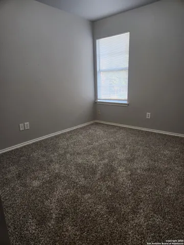 a bathroom with a bathtub and window