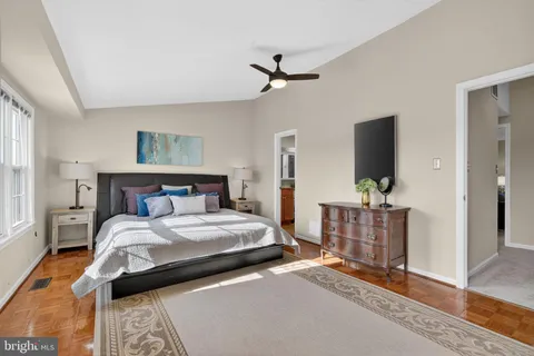 a bedroom with double bed and a flat tv screen
