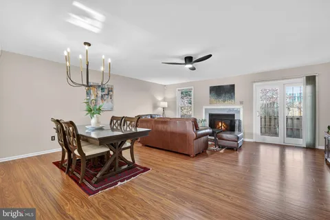 a living room with furniture a table and a fireplace