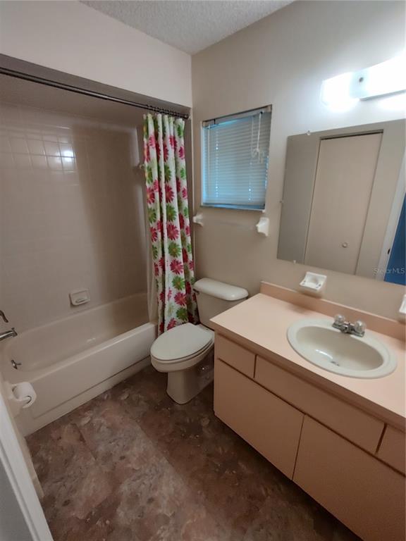 6345 Southwest 115th Street Road Ocala, FL 34476 - Photo 7 of 10 a bathroom with a sink a toilet and a bathtub