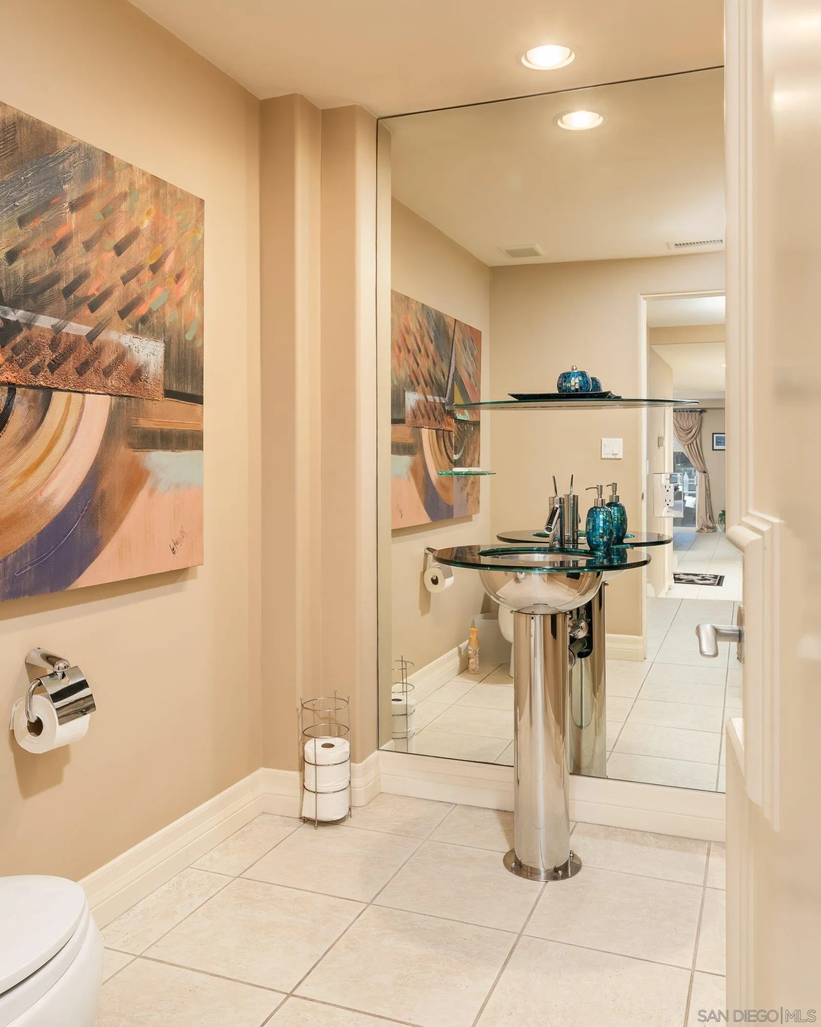 24 Sandpiper Strand Coronado, CA 92118 - Photo 13 of 56 a bathroom with a sink a toilet and shower