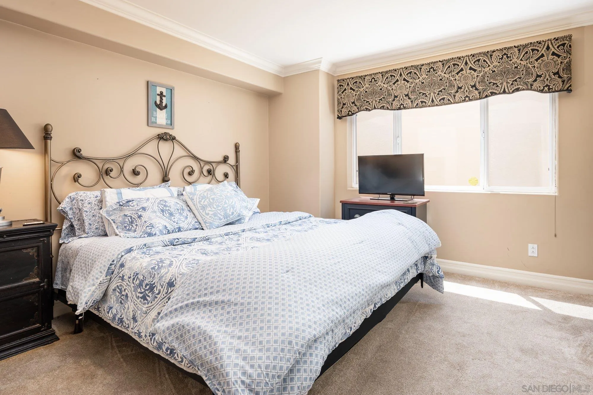 24 Sandpiper Strand Coronado, CA 92118 - Photo 14 of 56 a bedroom with a bed and a tv on the dresser