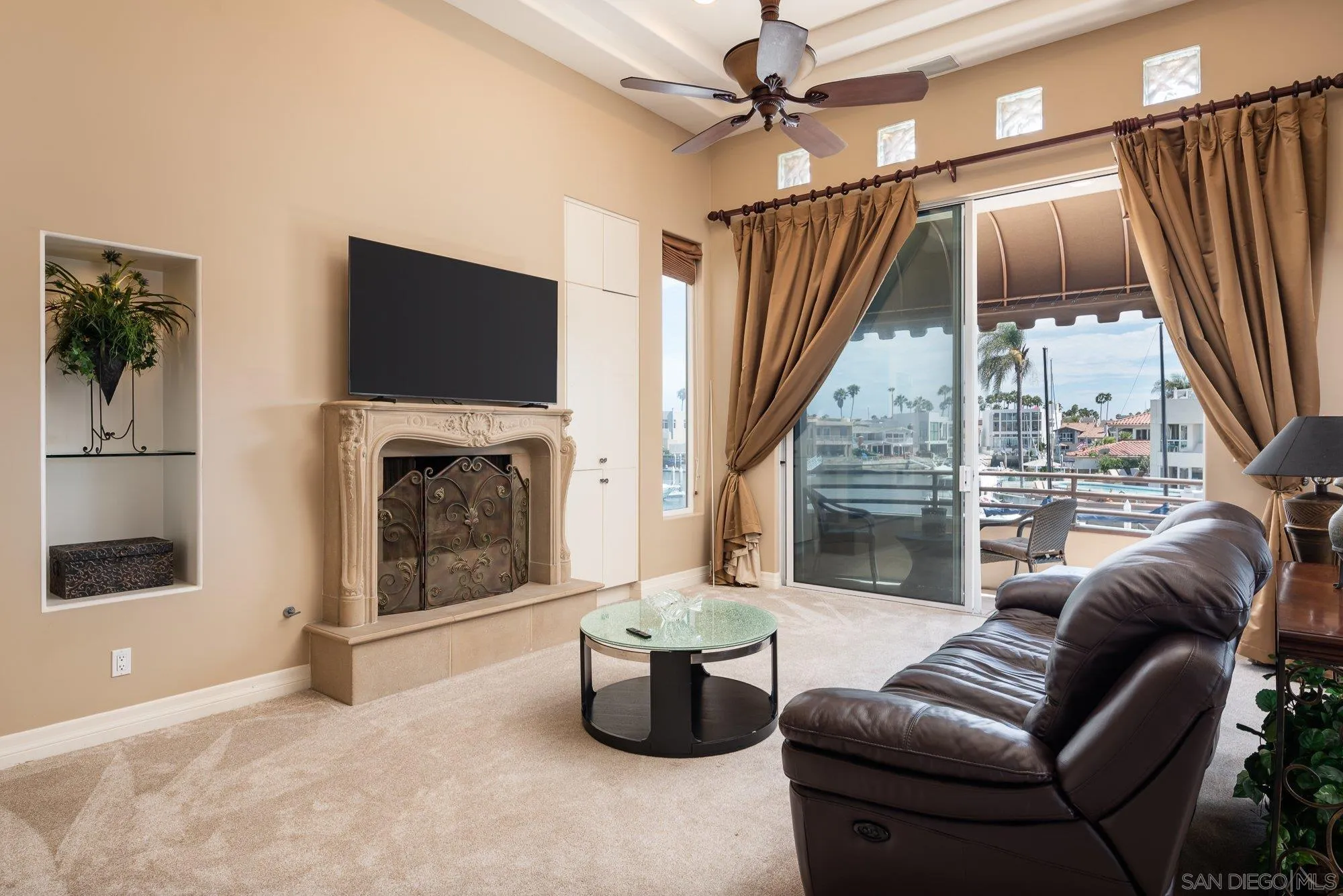 24 Sandpiper Strand Coronado, CA 92118 - Photo 18 of 56 a living room with furniture and a fireplace