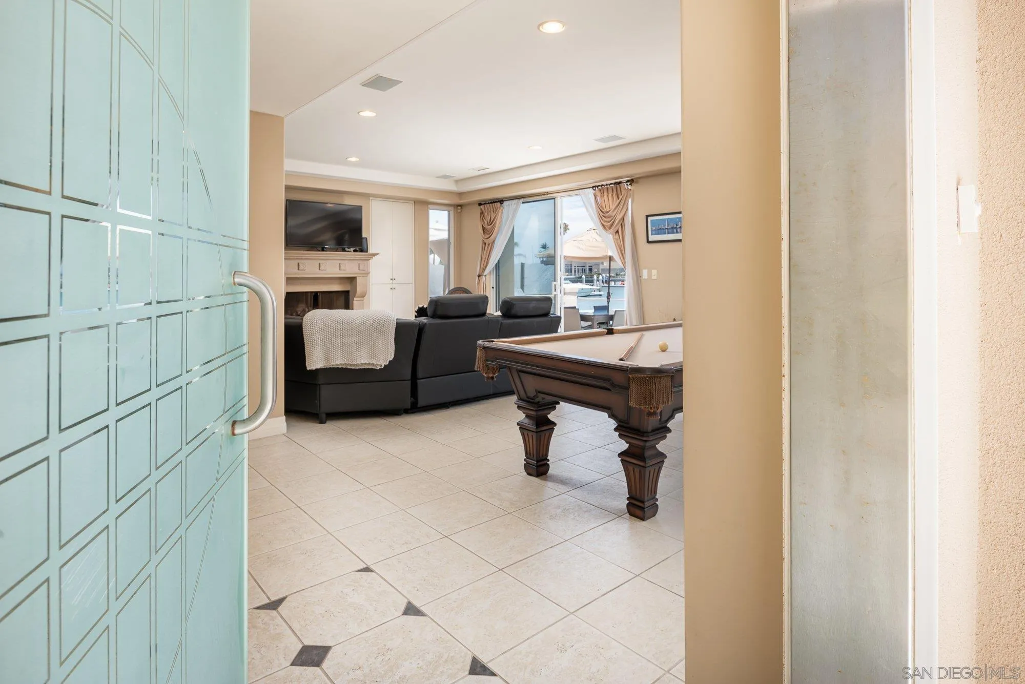 24 Sandpiper Strand Coronado, CA 92118 - Photo 3 of 56 a room with patio furniture and a window