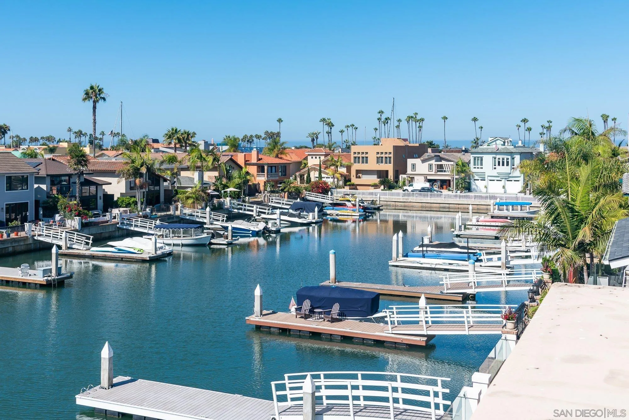 24 Sandpiper Strand Coronado, CA 92118 - Photo 35 of 56 a view of a lake with boats and trees in the background