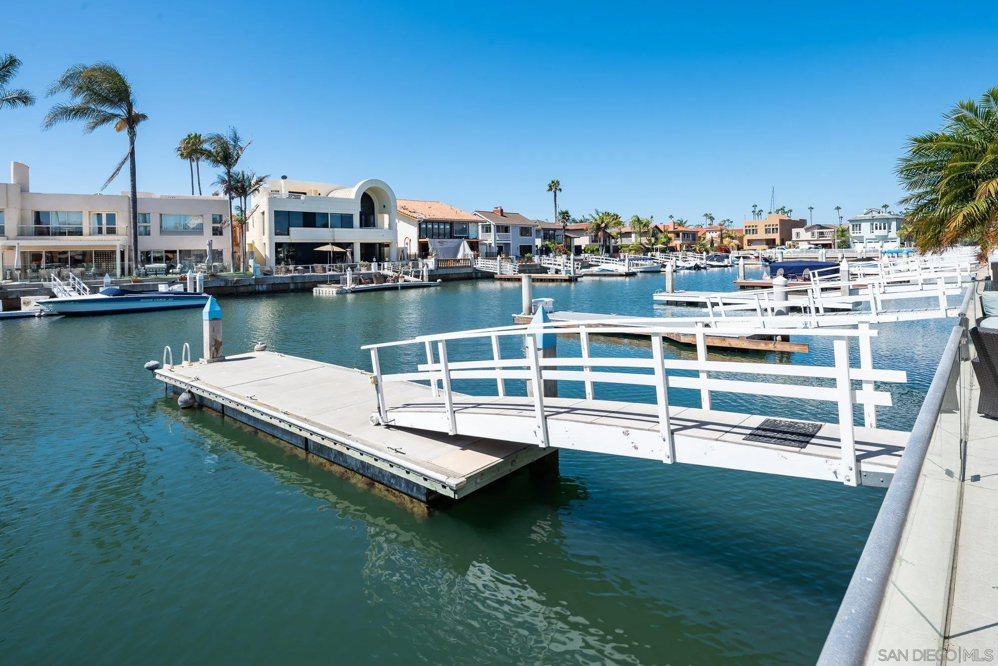 24 Sandpiper Strand Coronado, CA 92118 - Photo 40 of 56 a view of a lake with boats and trees in the background