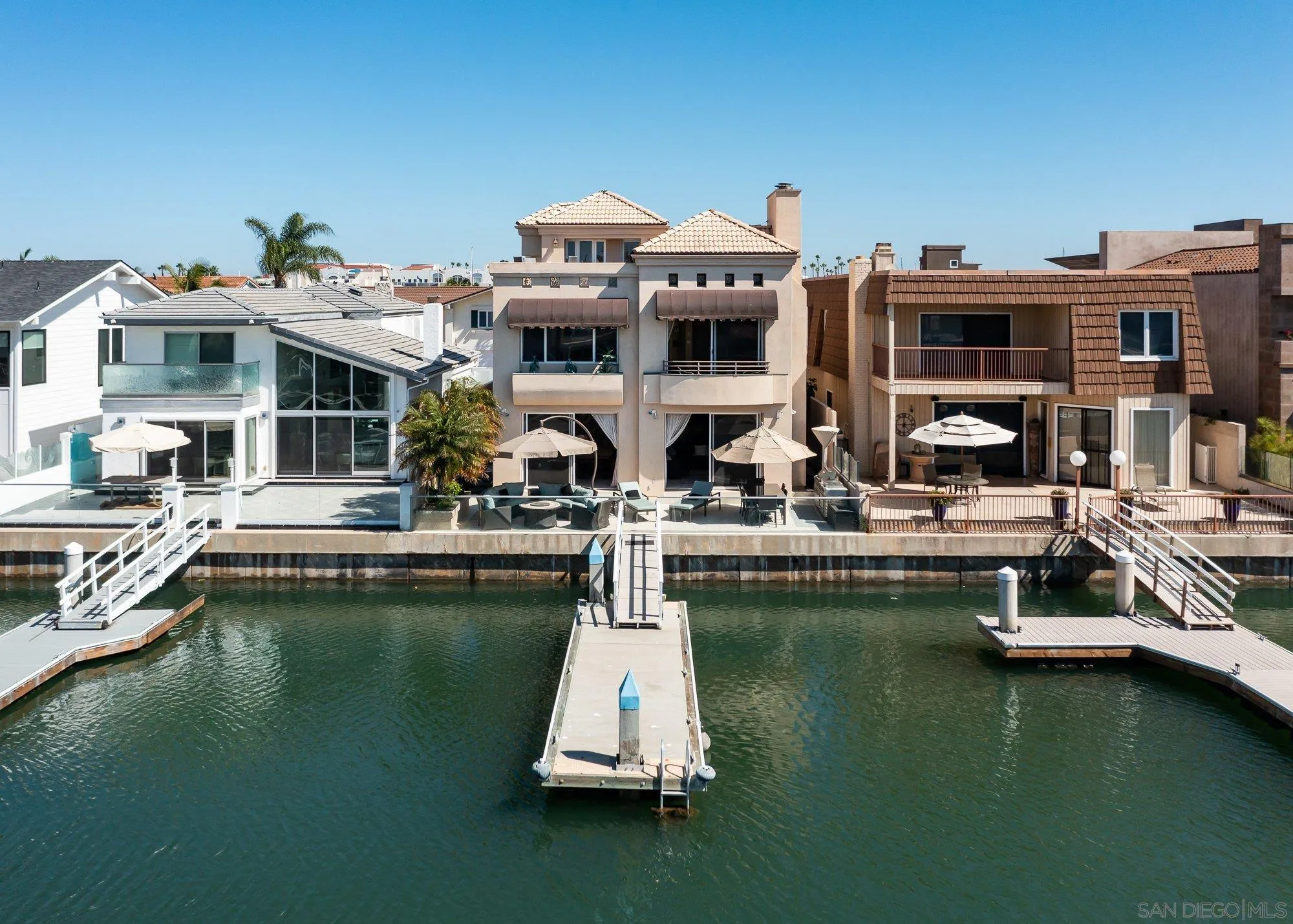 24 Sandpiper Strand Coronado, CA 92118 - Photo 45 of 56 a house with swimming pool in front of it