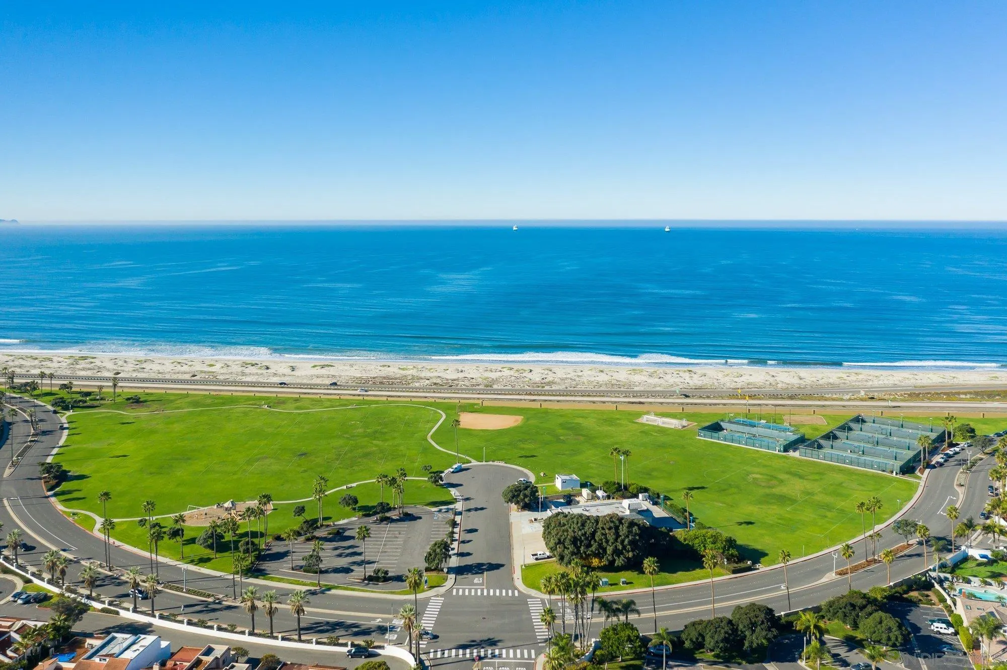 24 Sandpiper Strand Coronado, CA 92118 - Photo 52 of 56 a view of a swimming pool with a yard