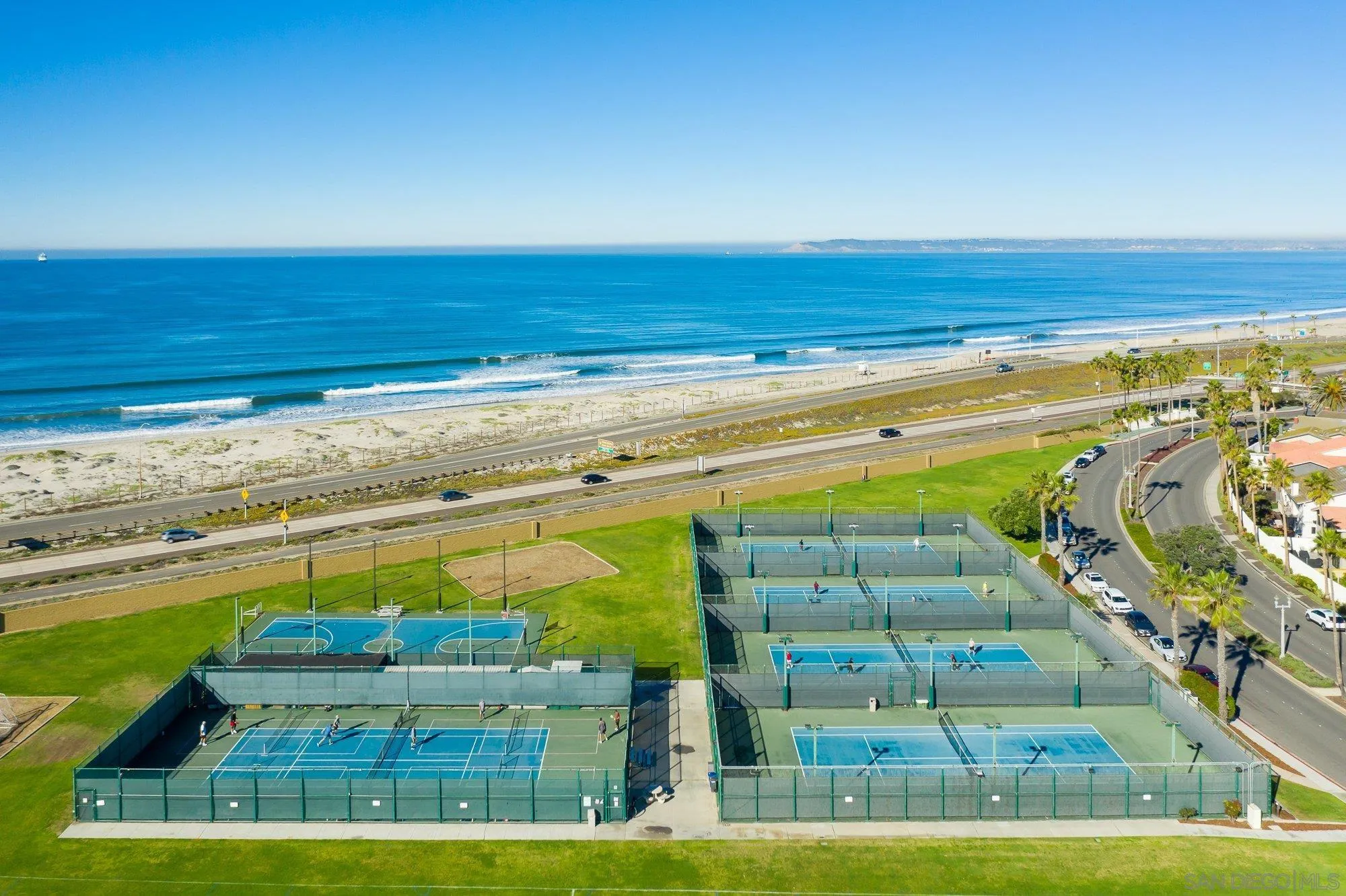 24 Sandpiper Strand Coronado, CA 92118 - Photo 53 of 56 a view of swimming pool with a yard and outdoor seating
