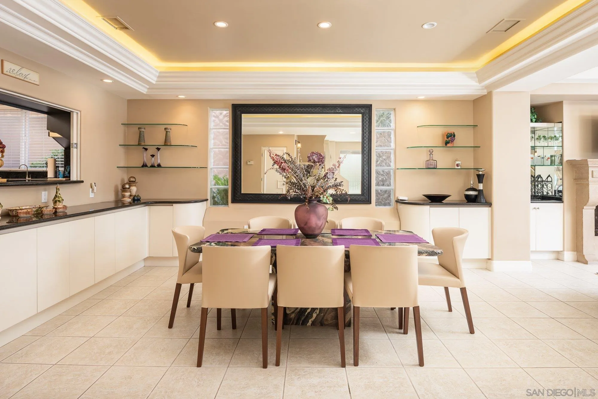 24 Sandpiper Strand Coronado, CA 92118 - Photo 8 of 56 a dining room with furniture and a large window