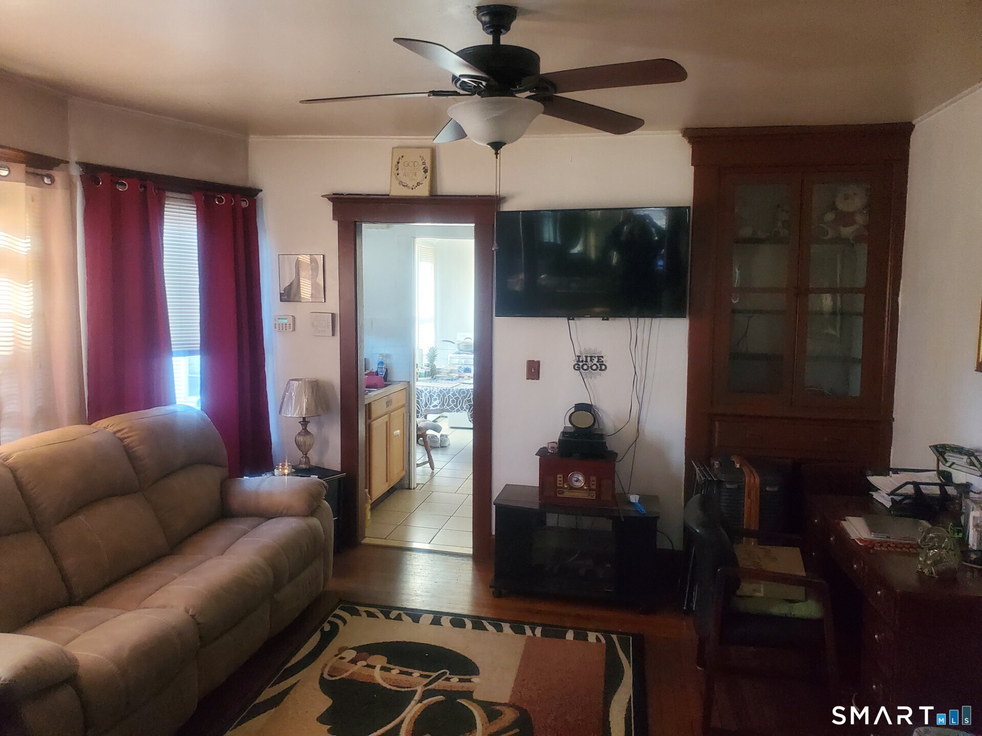 121 Pine Street New Haven, CT 06513 - Photo 5 of 8 a living room with furniture a flat screen tv and a fireplace