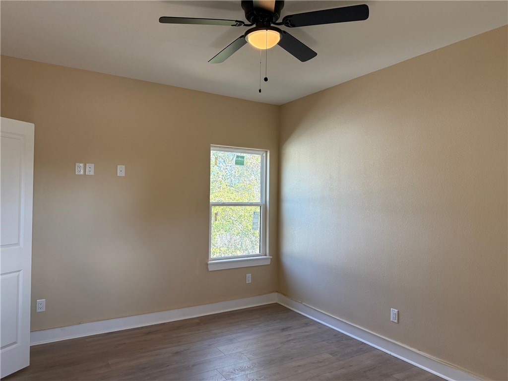 807 South Coulter Drive Bryan, TX 77803 - Photo 12 of 17 an empty room with a window and a fan