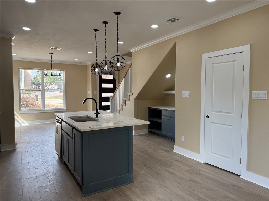 807 South Coulter Drive Bryan, TX 77803 - Photo 3 of 17 an open kitchen with a sink and dish washer