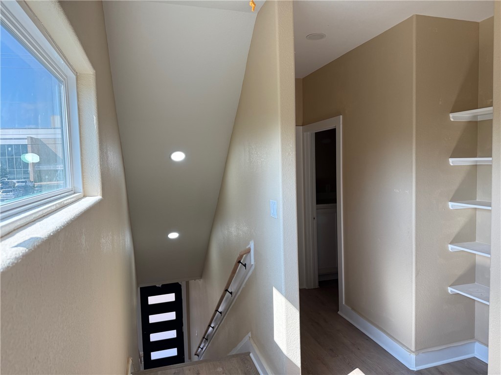807 South Coulter Drive Bryan, TX 77803 - Photo 8 of 17 a view of a hallway with windows and stairs
