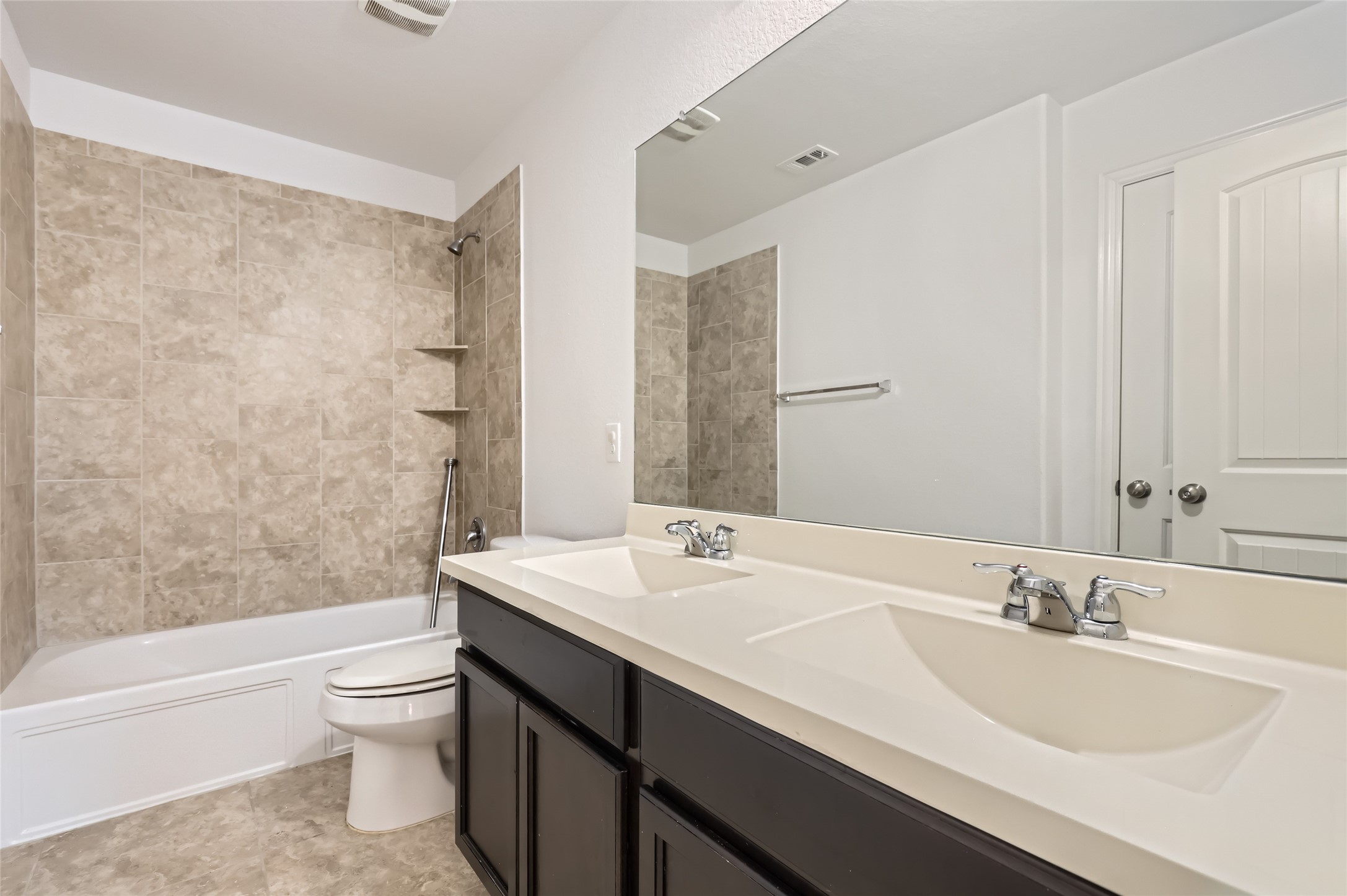 153 Ammonite Lane Jarrell, TX 76537 - Photo 22 of 26 a bathroom with a sink a toilet and shower