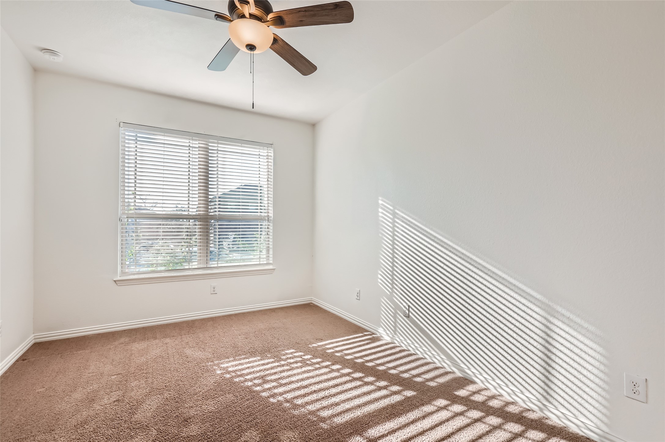 153 Ammonite Lane Jarrell, TX 76537 - Photo 10 of 26 a view of an empty room with a window