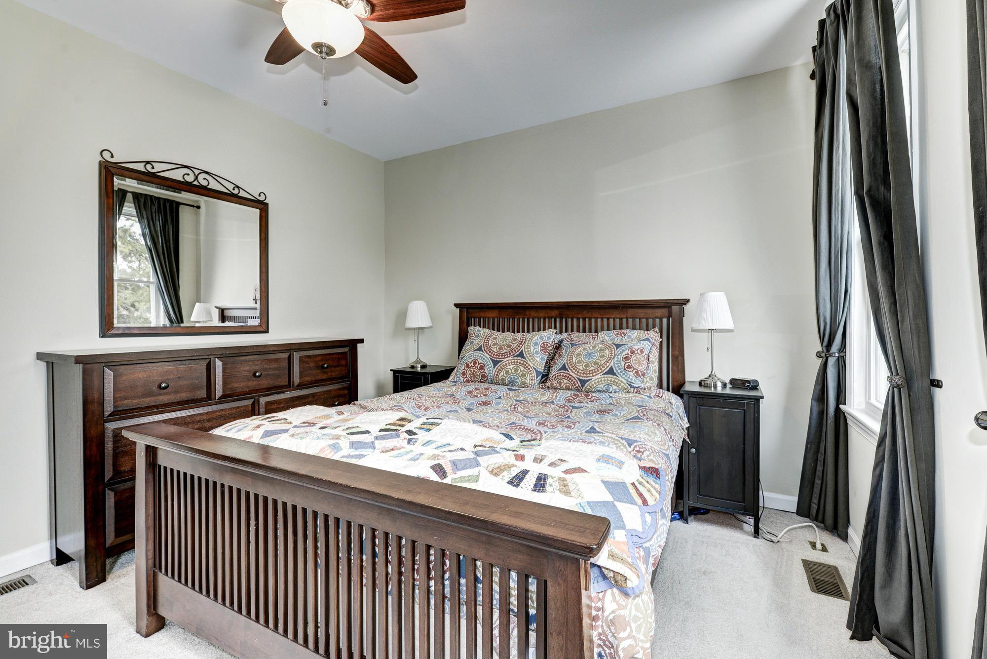 2017 2nd Street Northeast Washington, DC 20002 - Photo 16 of 23 a bedroom with a bed and a dresser