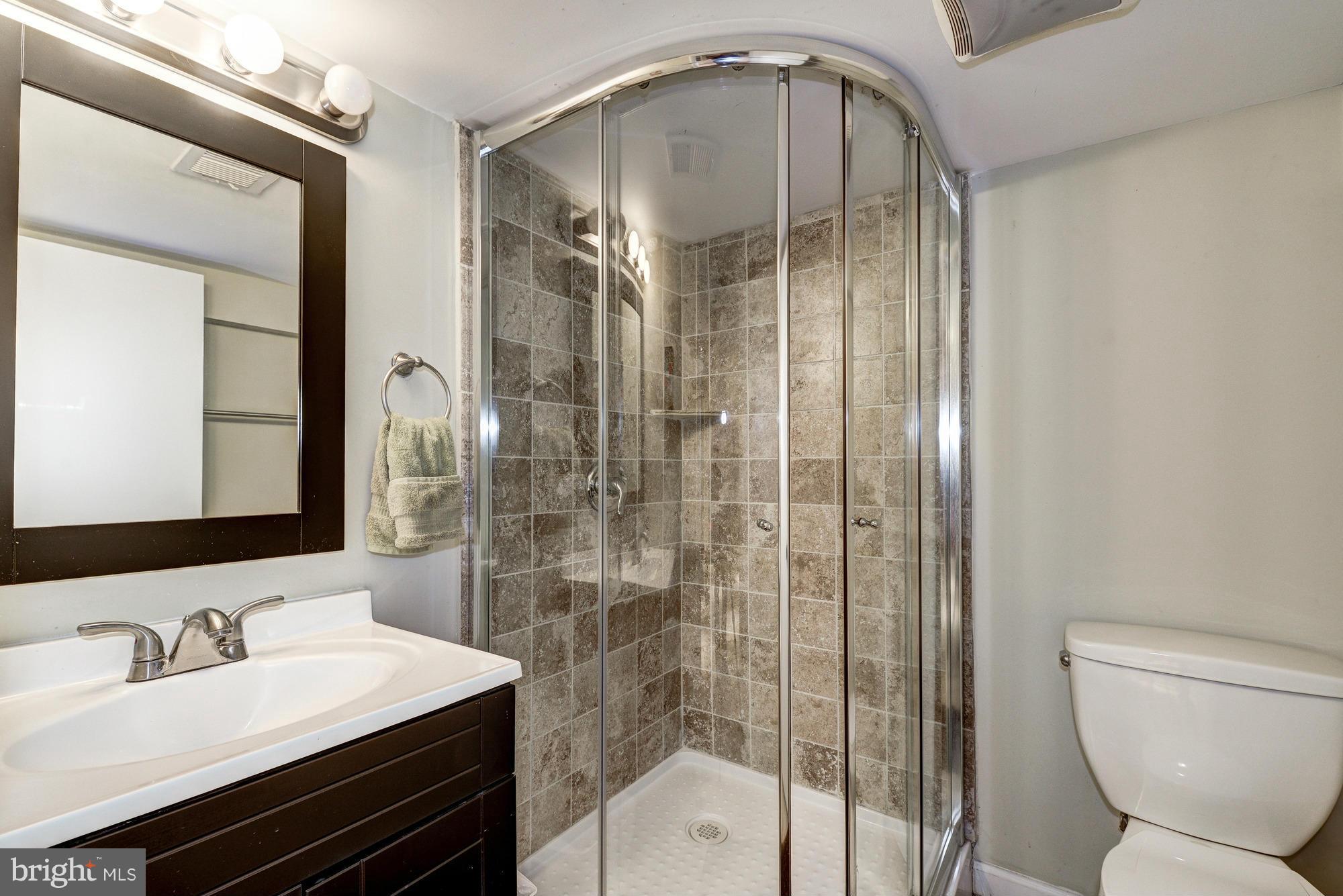 2017 2nd Street Northeast Washington, DC 20002 - Photo 19 of 23 a bathroom with a sink a toilet and shower