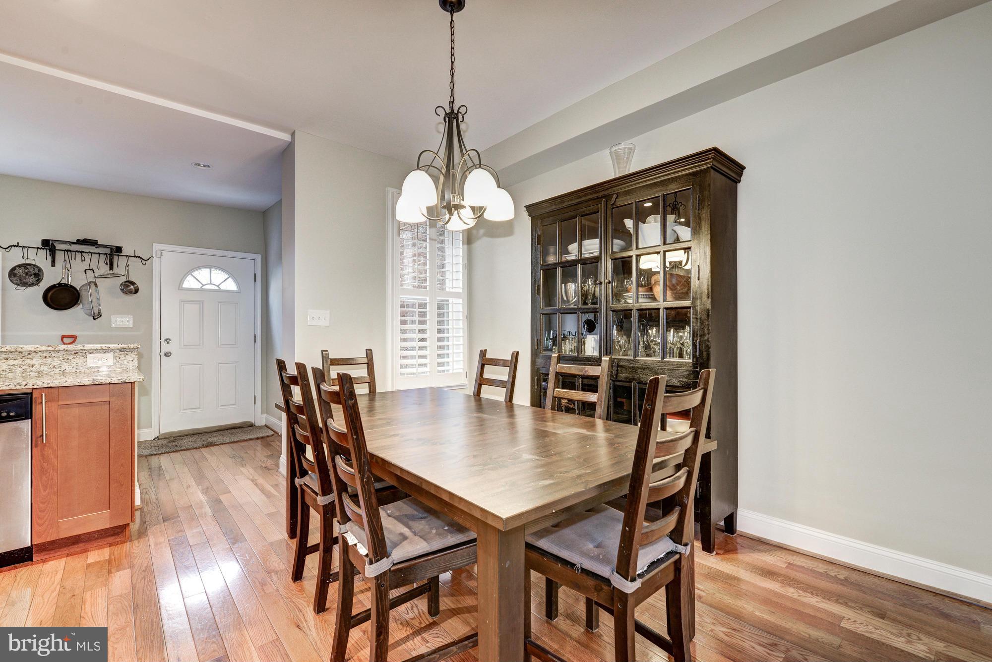 2017 2nd Street Northeast Washington, DC 20002 - Photo 6 of 23 a view of a dining room with furniture window and wooden floor