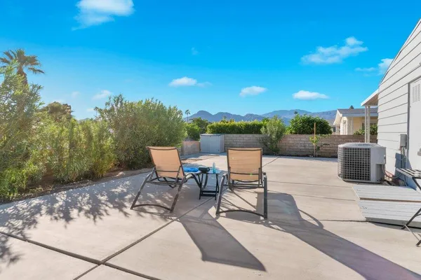 a view of a terrace with sitting area