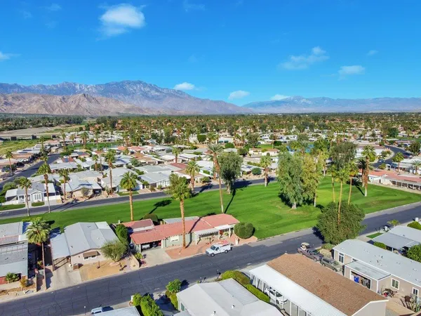 an aerial view of residential houses and outdoor space