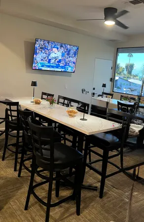 a living room with furniture and a flat screen tv