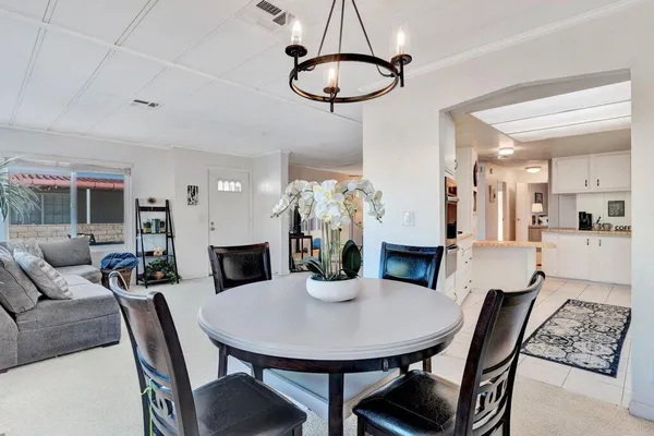 a dining room with furniture and window