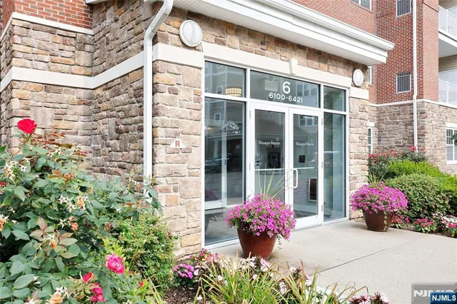 a front view of a multi story residential apartment building