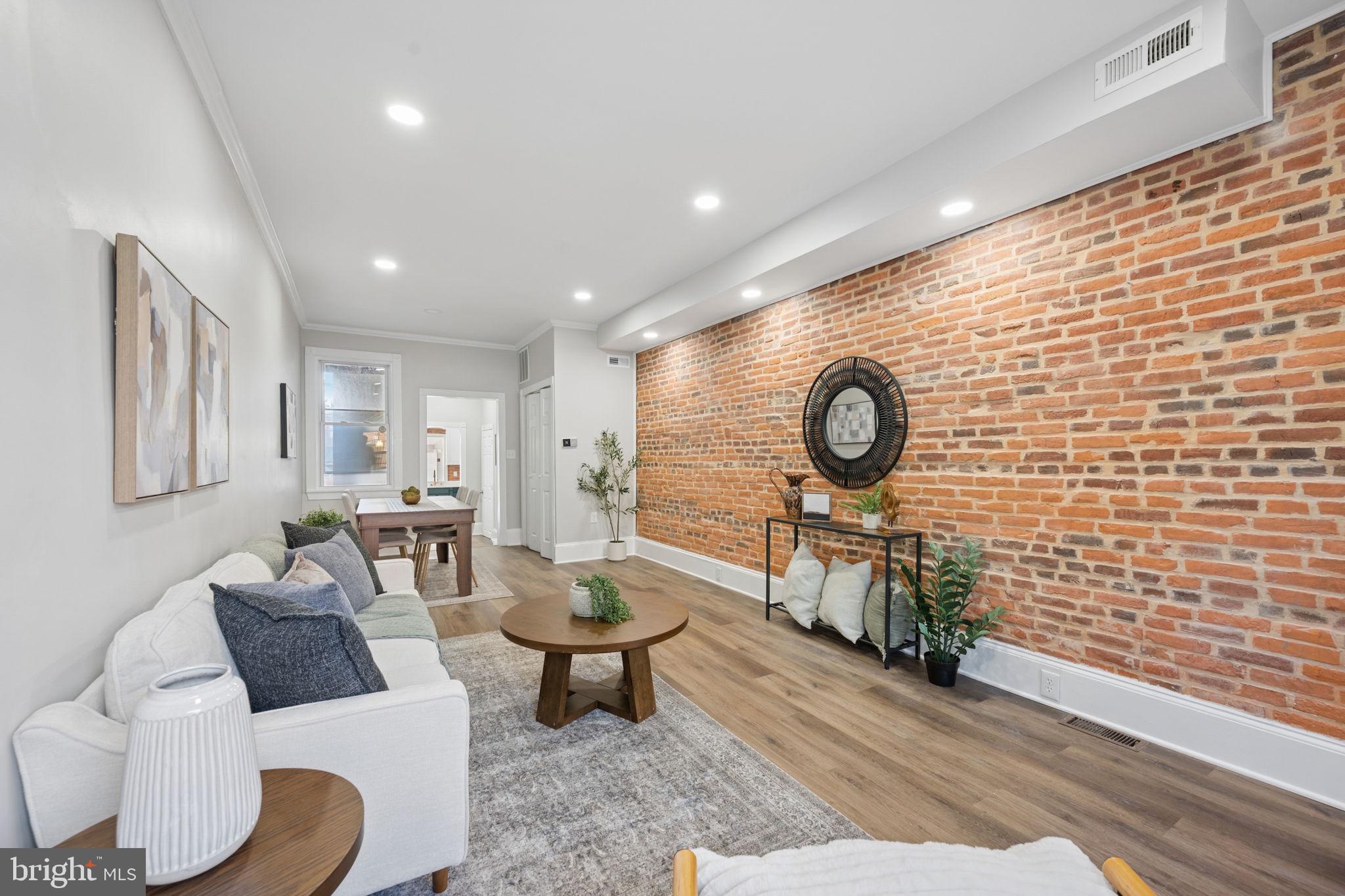 1108 South Clinton Street Baltimore, MD 21224 - Photo 6 of 66 Charming space with exposed brick warmth.
