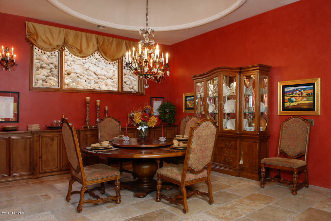 2188 East Buck Ridge Place Oro Valley, AZ 85737 - Photo 10 of 22 a dining room with furniture a chandelier and window